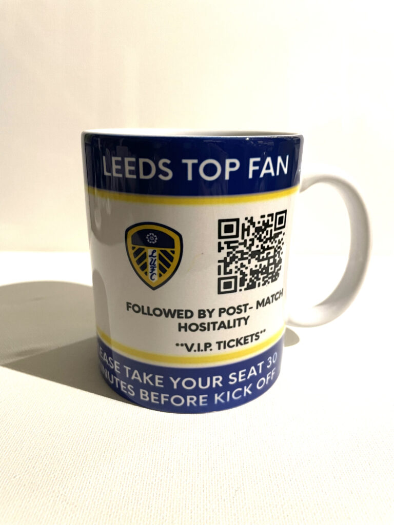 Why Choose Our Customised Leeds United Mug Services? Unique Designs: Personalize your mug with official Leeds United logos, player names, or custom text to make your drinkware uniquely yours. Premium Quality: Our mugs are made from durable, high-quality ceramic, and printed with vibrant, long-lasting colors that proudly display your allegiance to Leeds United. Variety of Options: Choose from a range of sizes and styles, including classic mugs and travel mugs, to suit your needs and preferences. Easy Ordering: Our user-friendly online platform allows you to easily design and order your custom Leeds United mugs, perfect for personal use or as gifts. Fast Turnaround: Enjoy quick and reliable service with mugs printed and delivered promptly, just in time for the next match.